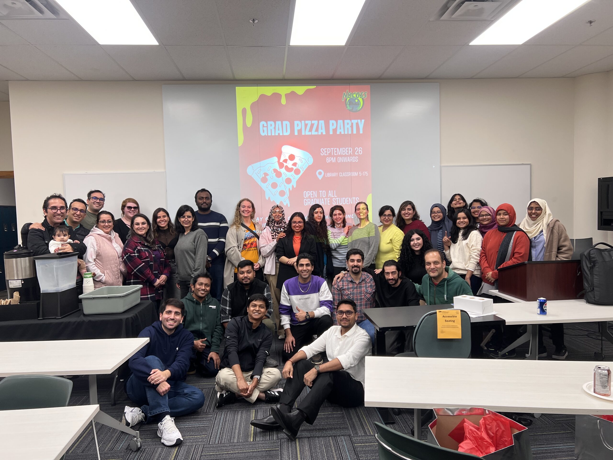 Students at the welcome pizza party